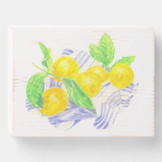 Meyer lemons on kitchen towel wooden box sign