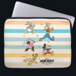 Mickey & Friends Retro Stars and Stripes Graphic Laptop Sleeve<br><div class="desc">Get ready for adventure with the whole crew! This vibrant "Mickey and Friends" design features the iconic Fab Five—Mickey, Minnie, Donald, Goofy, and Pluto—striding forward in a classic, retro art style. Accented with playful stars and a backdrop of stylish, muted stripes, this graphic captures the timeless joy of Disney friendship....</div>