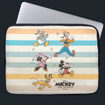 Mickey & Friends Retro Stars and Stripes Graphic Laptop Sleeve<br><div class="desc">Get ready for adventure with the whole crew! This vibrant "Mickey and Friends" design features the iconic Fab Five—Mickey, Minnie, Donald, Goofy, and Pluto—striding forward in a classic, retro art style. Accented with playful stars and a backdrop of stylish, muted stripes, this graphic captures the timeless joy of Disney friendship....</div>