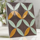 Mid-Century Crescent and Wave in Mint and Mustard Ceramic Tile<br><div class="desc">Embrace atomic-era elegance with this mid-century design featuring overlapping crescent moon shapes, wave-inspired patterns, and subtle linear textures. Designed in retro mint green, bold mustard, and deep walnut brown, this piece brings vintage sophistication and energy to backsplashes, accent walls, or stylish interior décor. Its symmetrical layout and timeless color palette...</div>