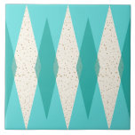 Mid Century Modern Argyle Ceramic Tile<br><div class="desc">This Mid Century Modern Argyle Large Ceramic Tile features a vibrant, turquoise background and a pattern of mod, translucent teal diamonds overlaying larger, vintage cream diamonds with gold colored, space age speckles. This minimalist inspired, deconstructed argyle is a simplistic throwback of the larger than life atomic era that dominated the...</div>