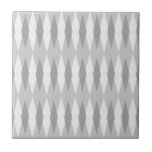 Mid Century Modern Grey Argyle Ceramic Tile<br><div class="desc">This Mid Century Modern Grey Argyle Ceramic Tile (small print) features a dove grey background and a pattern of mod, translucent, dark grey diamonds overlaying larger, vintage white diamonds with grey colored, space age speckles. This minimalist inspired, deconstructed argyle is a simplistic throwback of the larger than life atomic era...</div>