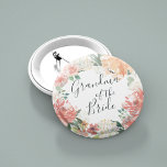 Midsummer Floral Grandma of the Bride Pinback Button<br><div class="desc">Identify the key players at your bridal shower with our elegant,  sweetly chic floral buttons. Button features a watercolor floral wreath of peachy pink peonies,  white hydrangea flowers and botanical greenery with "grandma of the bride" inscribed inside in hand lettered script.</div>