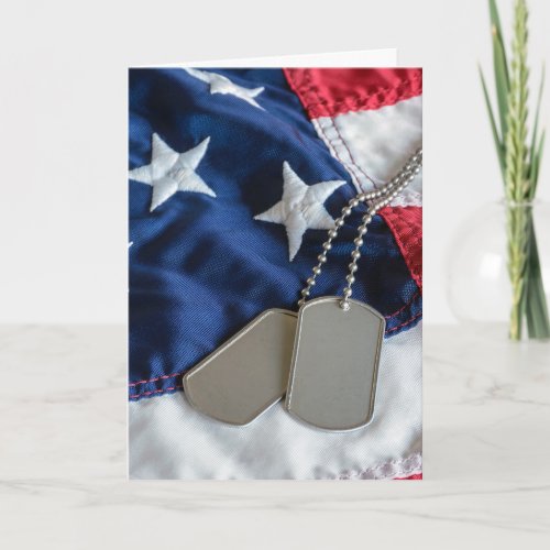 military dog tags on flag card