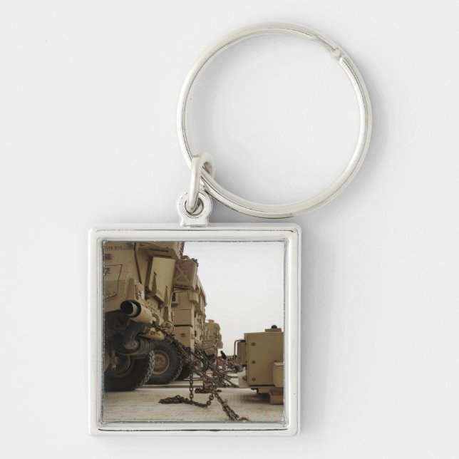 Military vehicles are locked down on semi truck keychain (Front)