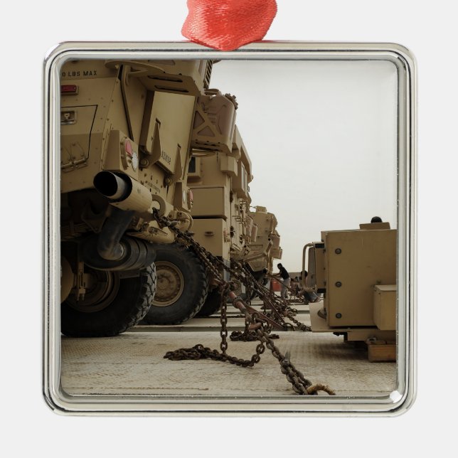 Military vehicles are locked down on semi truck metal ornament (Front)