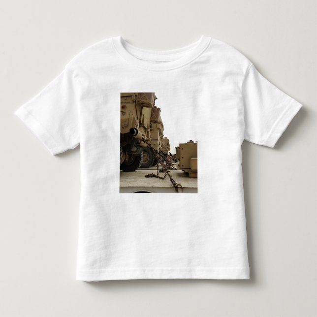 Military vehicles are locked down on semi truck toddler t-shirt (Front)
