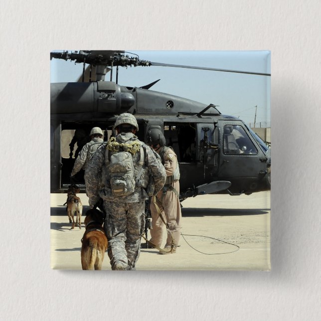 Military working dog handlers board a helicopte button (Front)