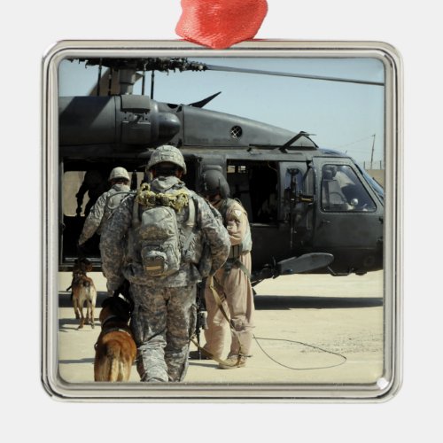 Military working dog handlers board a helicopte metal ornament