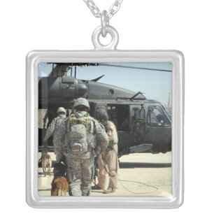 Military working dog handlers board a helicopte silver plated necklace