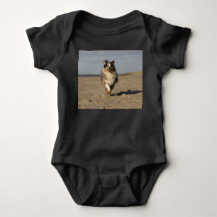 Miniature American Shepherd Running On Beach Baby Bodysuit
