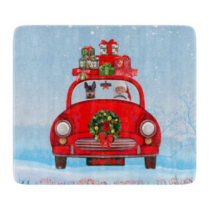 Miniature Pinscher Dog In Car With Santa Claus Cutting Board