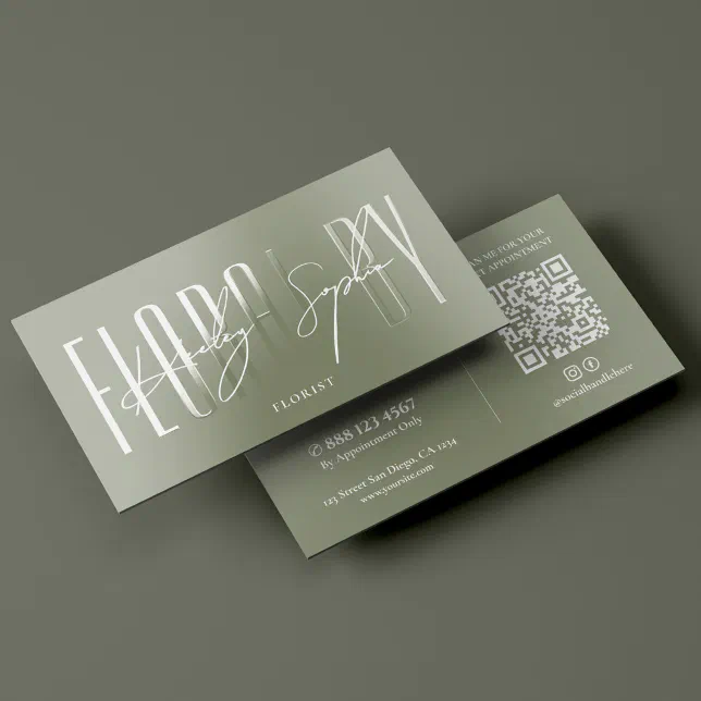 A sage green spot UV business card for a florist against an olive green background.