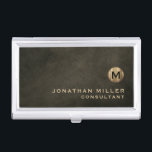 Minimal Luxury Black Gold Monogram Business Card Case<br><div class="desc">Minimalist monogram design with brushed metallic gold monogram medallion with personalized name and title or custom text below in classic block typography on a textured background in shades of black chestnut brown. Personalize for your custom use.</div>