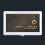 Minimal Luxury Black Gold Monogram Business Card Case<br><div class="desc">Minimalist monogram design with brushed metallic gold monogram medallion with personalized name and title or custom text below in classic block typography on a textured background in shades of black chestnut brown. Personalize for your custom use.</div>