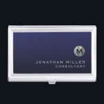 Minimal Luxury Navy Blue Silver Monogram Business Card Case<br><div class="desc">Minimalist monogram design with brushed metallic silver monogram medallion with personalized name and title or custom text below in classic block typography on a gradient background in shades of navy blue. Personalize for your custom use.</div>
