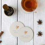 Minimalist Autumn Leaf "Fall in Love" Personalized Round Paper Coaster<br><div class="desc">Fall in love with this modern and minimal design for autumn weddings, engagement parties, or rehearsal dinners. Clean, minimalist design features a soft off-white background graced with a single watercolor leaf in warm fall colors. "Fall in love" appears beneath, along with the couple's names or your choice of personalization in...</div>