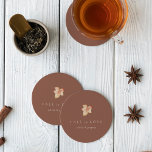 Minimalist Autumn Leaf "Fall in Love" Personalized Round Paper Coaster<br><div class="desc">Fall in love with this modern and minimal design for autumn weddings, engagement parties, or rehearsal dinners. Clean, minimalist design features a terracotta rust background graced with a single watercolor leaf in warm fall colors. "Fall in love" appears beneath, along with the couple's names or your choice of personalization in...</div>