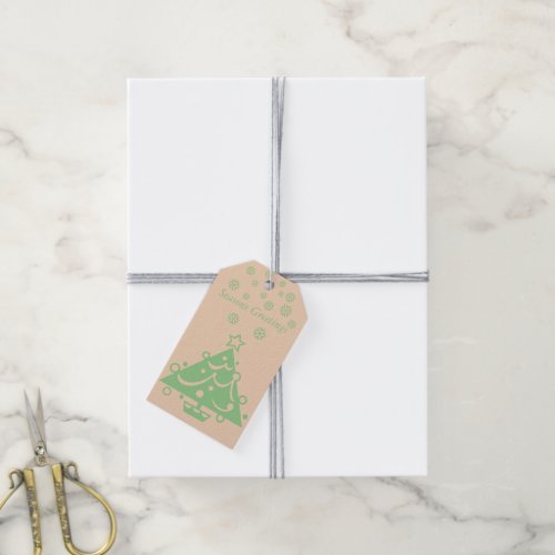 minimalist beige and green candle at christmas gift tags