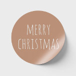 Minimalist Christmas | Light Terracotta Holiday Classic Round Sticker<br><div class="desc">Wrap your holidays in understated elegance with this minimalist Christmas sticker, featuring a soothing light terracotta background. The cozy handwritten style font adds a warm, personal touch to your festive celebrations. Whether sealing gift packages, embellishing holiday cards, or adding charm to party favors, this round sticker effortlessly blends modern simplicity...</div>