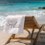 Minimalist Custom Bride Name  Beach Towel<br><div class="desc">Celebrate your special day in chic simplicity with this personalized bride beach towel. Featuring a clean white background and a stylish script font with the bride’s name and the word “BRIDE, ” it’s the perfect bachelorette gift, honeymoon accessory, or beach day essential for the future Mrs. Soft, elegant, and totally...</div>
