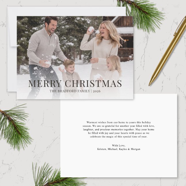 Minimalist Family Photo Christmas Card (image of single one photo minimalist simple christmas card with message on back on marble surface)