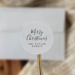 Minimalist Merry Christmas Holiday Gift Classic Round Sticker<br><div class="desc">These minimalist Merry Christmas holiday gift stickers are perfect for a simple holiday present or holiday card. The design features classic black and white typography paired with a rustic yet elegant script font with hand lettered style. Personalize the stickers with your name.</div>
