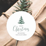 Minimalist Merry Christmas Tree Personalized Classic Round Sticker<br><div class="desc">Minimalist Green and white script handwritten Merry Christmas holiday Tree Classic Round Sticker. These stickers can be personalized with your own name. Perfect for gift labels and mailing stickers.</div>