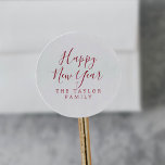 Minimalist Red Happy New Year Holiday Gift Classic Round Sticker<br><div class="desc">These minimalist red Happy New Year holiday gift stickers are perfect for a simple holiday present or holiday card. The design features classic red and white typography paired with a rustic yet elegant script font with hand lettered style. Personalize the stickers with your name.</div>
