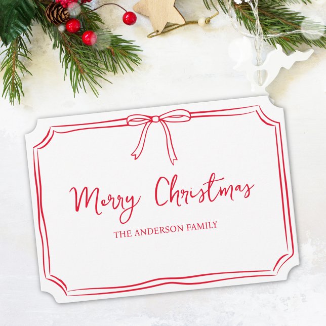 Minimalist Red & White Bow Cute Merry Christmas Card (Personalize your Christmas wishes with a custom family name on this chic, festive card.)