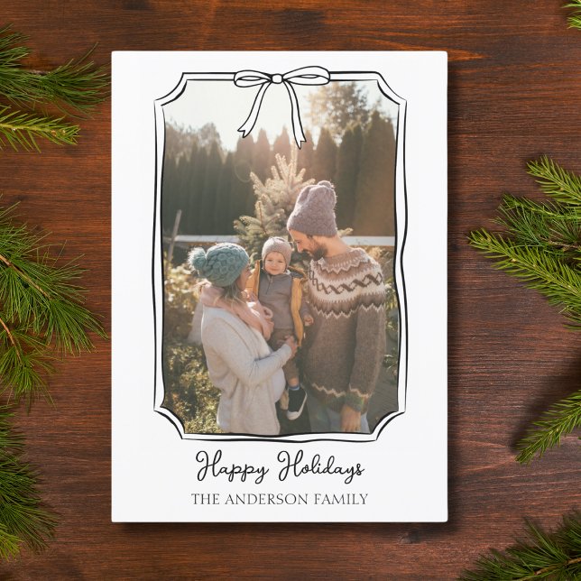 Minimalist Simple Bow Black and White Family Photo Holiday Card (A timeless holiday card that radiates warmth, elegance, and effortless personalization.)