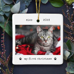Minimalist Typewriter Cat's First Christmas Photo Ceramic Ornament<br><div class="desc">These simple and minimalist Christmas holiday ornaments feature your favorite photo of your cat or kitten on the front along with his name, the year, and the words "my first christmas" in black typewriter look text with two cute paw prints. The back features another photo of your pet, lightened with...</div>