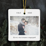 Minimalist Typewriter | First Christmas Engaged Ceramic Ornament<br><div class="desc">These simple and minimalist Christmas holiday ornaments feature your favorite personal photo on the front along with your initials, the year, and the words "first christmas engaged" in black typewriter look text. The back features another of your personal photos, lightened with an overlay so that you can add additional text...</div>