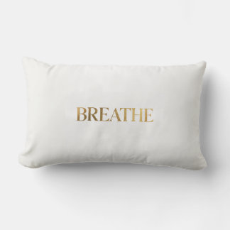 Minimalist typography with gold word breathe lumbar pillow
