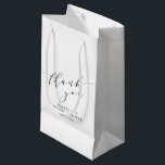 Minimalist White Black Bridal Shower Thank You Small Gift Bag<br><div class="desc">Make your bridal shower or special event extra memorable with this stylish personalized gift bag. Featuring a minimalist "thank you" in elegant script, this design blends modern sophistication with timeless charm. Perfect for bridal party gifts, wedding favors, or special thank-you treats, this customizable bag adds a thoughtful touch to any...</div>