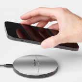 Minimalistic metallic silver background wireless charger  (Hand)