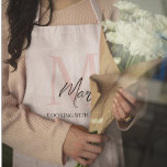 Minimalistic Monogram Initial & Name Pastel Pink Apron<br><div class="desc">Cook and bake in style with our Minimalistic Monogram Initial & Name Pastel Pink Apron. This elegant apron features a sleek design personalized with your initial and name, set against a soft pastel pink background. Made from high-quality, durable fabric, it offers excellent protection and comfort while you prepare your favorite...</div>