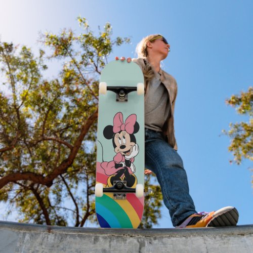 Minnie Mouse  Sitting on a Rainbow Skateboard