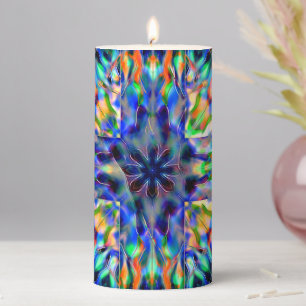 Mint flaming ball under acrylic piece out of focus pillar candle