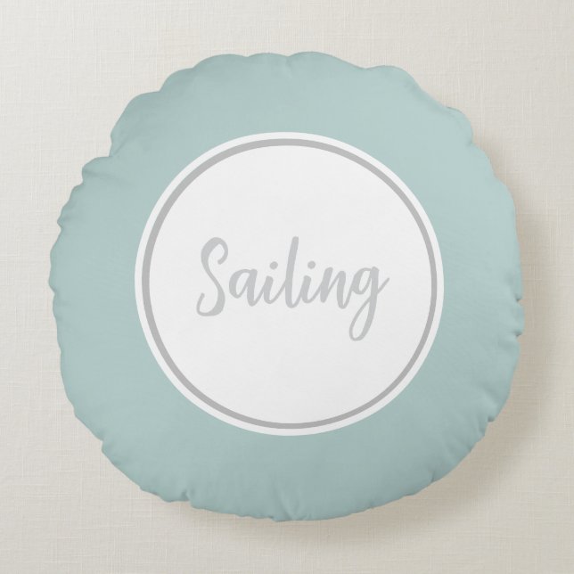 Mint Green Round Throw Pillow with text 'Sailing' (Front)