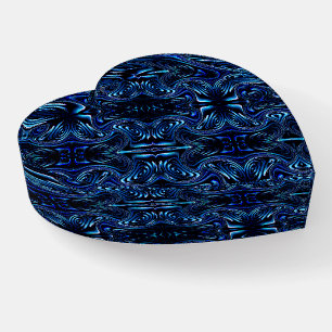 Mirroring formed flower and butterfly in dark blue paperweight