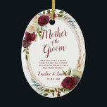 Mistletoe Manor To the Mother of the Groom Quote Ceramic Ornament<br><div class="desc">Mistletoe Manor Watercolor Lush Roses Design with Hand Painted Florals, Holly Berry Leaves, Pine Sprig Foliage, and Watercolor Paint Brush Strokes. Colorful Marsala, Wine Merlot Red, Burgundy, Ivory Cream, and Green. With Swirly Chic Typography Brush Script Fonts and Rose Gold Elegant Floral Oval Frame - Mother of the Groom Heartfelt...</div>
