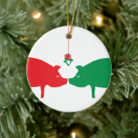 Mistletoe Pigs Ornament<br><div class="desc">Whimsical and special!  This red and green ornament is delightful to give.  You can personalize the message on the back to whatever you like.  The design is by artist,  d.a.gordon dart.  To view more of her work visit: www.dagdart.com.</div>