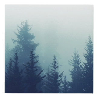 Misty fog in pine forest on mountain slopes. Color Faux Canvas Print