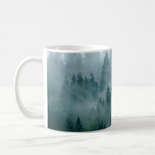 Misty landscape with fir forest in hipster vintage coffee mug