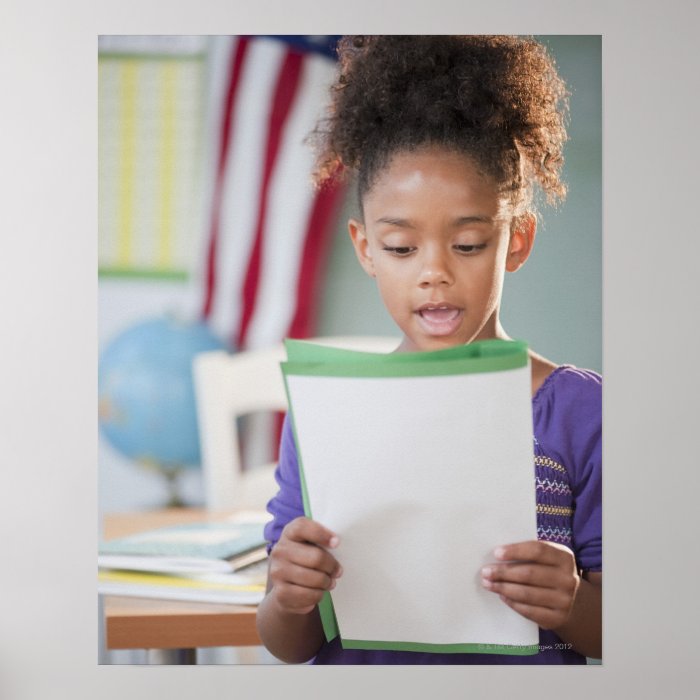 Mixed race girl reading report at school poster