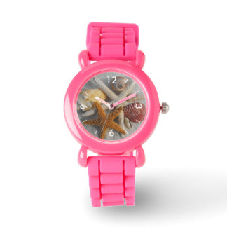 Mixed Sea Shells and Starfish on White Sand Beach Watch