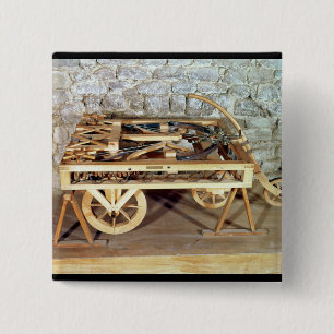 Model of a car driven by springs pinback button