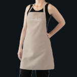 Modern beige tan custom script name solid plain apron<br><div class="desc">Personalized beige tan neutral custom modern script name text monogram solid plain color girly stylish elegant chic beige tan neutral and white text kitchen Apron. Custom white text on solid plain beige background. Customize, personalize it with name, quote, phrase, or text. Great for cooks, chefs, pottery, ceramics, crafts, work, kitchen,...</div>