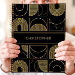 Modern Black and Gold Geometric Custom Name Planner<br><div class="desc">This modern planner design features a bold black background adorned with a sophisticated geometric pattern in radiant gold. The custom name showcased at the center adds a sleek and personal touch to the overall design. Perfect for professionals, students, or anyone who values contemporary and luxurious aesthetics. Use it to organize...</div>